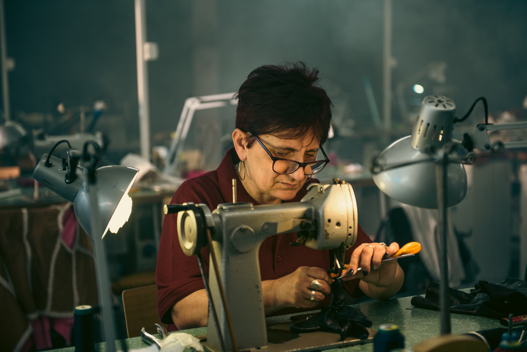 Artisan at sewing machine